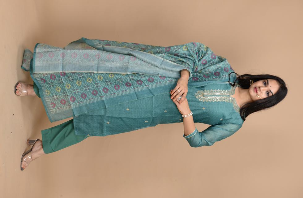 Gorgeous Pure Chanderi Suit Set With Aari Tari Work In Bottle Green Color