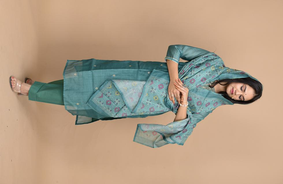 Gorgeous Pure Chanderi Suit Set With Aari Tari Work In Bottle Green Color